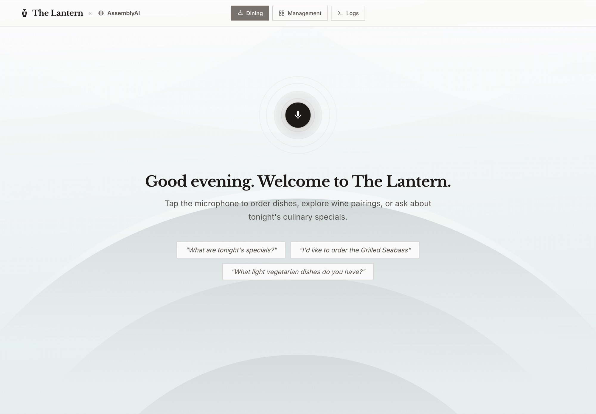 The Lantern on a table tablet: the microphone, “Good evening. Welcome to The Lantern.”, and three suggested requests.